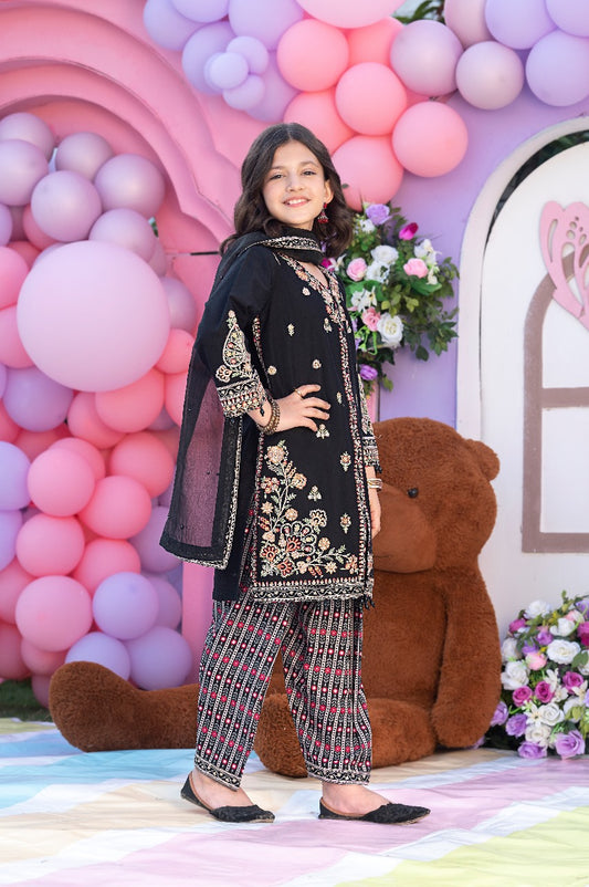 shirt adorned with sequin embroidery and hanging tassels.